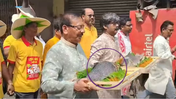 TMC minister and Tollygunj TMC candidate Aroop Biswas campaigning with fish in hand on Poila Boishakh TMC minister and Tollygunj TMC candidate Aroop Biswas campaigning with fish in hand on Poila Boishakh