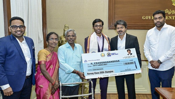 Tamil Nadu CM Vijay Plays Chess With Grandmaster Praggnanandhaa Tamil Nadu CM Vijay Plays Chess With Grandmaster Praggnanandhaa