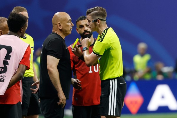 Egypt head coach Hossam Hassan is shown a yellow card by referee Francois Letexier Egypt head coach Hossam Hassan is shown a yellow card by referee Francois Letexier