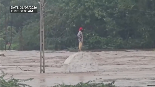 Youth Stranded in Surging Ashwin River as Heavy Rains Hit Gujarat s Chhotaudepur Youth Stranded in Surging Ashwin River as Heavy Rains Hit Gujarat s Chhotaudepur