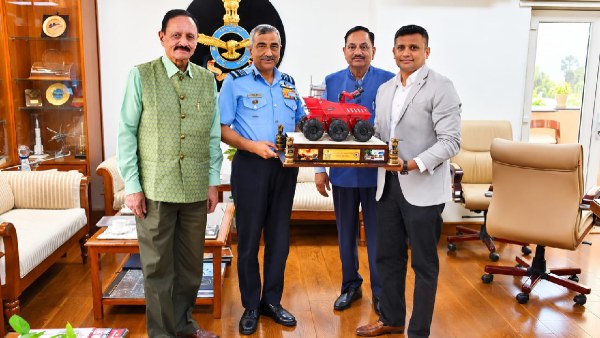 IAF Chief designate Air Marshal Ashutosh Dixit with Abhishek Modi Swadeshi Empresa CMD presenting a scale model of made In India robotic firefighting system Defence Ministry iDEX s 1st winner