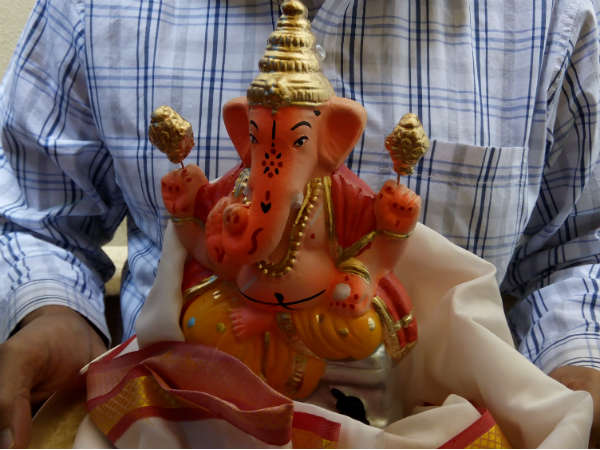 Perform pooja to Eco-friendly clay Ganesha