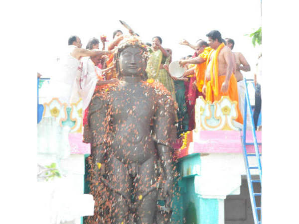 Gomateshwara statue take many colours during Mastakabhisheka
