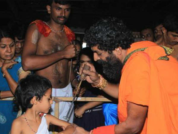  Devotees take part in Tapta Mudradharana in Krishna Temple udupi