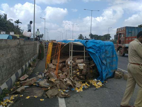 liquor full of Van met with an accident near Tumkur