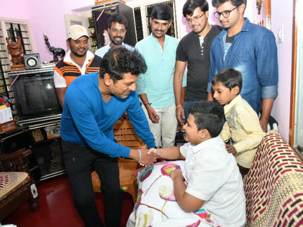 Kannada film actor Shiva Rajakumar meets his fan who lost his leg in an accident