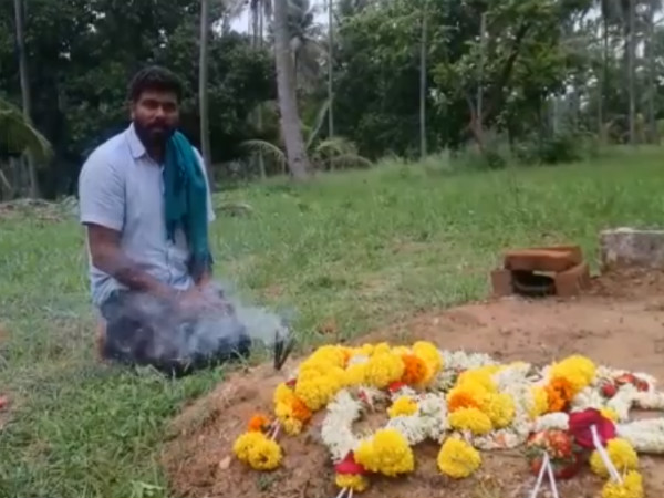 Darshan Puttannaiah vows in front of his father tomb Darshan Puttannaiah vows in front of his father tomb