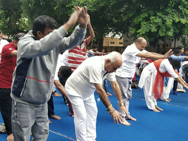 international yoga day: yeddyurappa performs yoga in bjp office