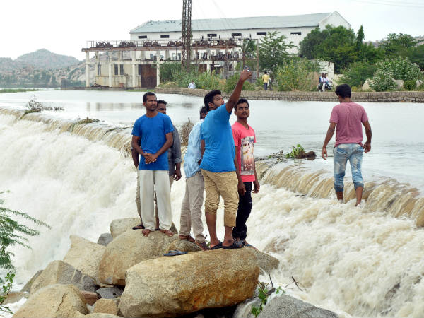 WCheck dam is overflowing near Kenchanagudda in Bellary District