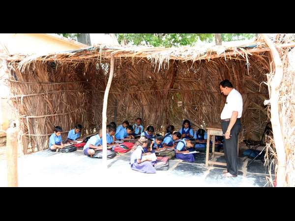 children studying at coconut palm shed at Jittinakatti village