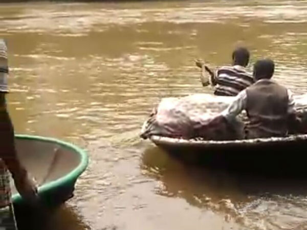 Villagers brought dead body on a raft in the village of Holekudige Villagers brought dead body on a raft in the village of Holekudige
