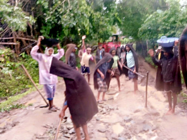 Disappointed by administration villagers repair road by themselves