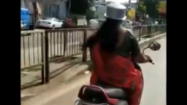 A Video of A woman Wearing Utensil as Helmat Goes Viral A Video of A woman Wearing Utensil as Helmat Goes Viral