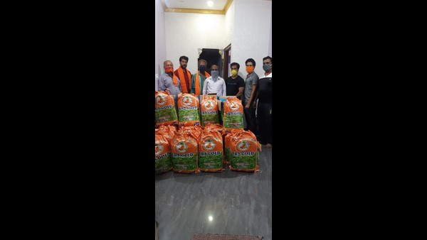 Teacher couple Distributing Food Grains In Channapattana