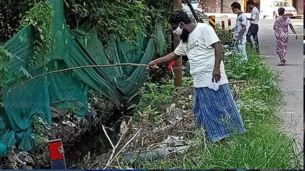 Kerala: Out of hunger, migrant labourers catch fishes from contaminated drains in Thrissur Kerala: Out of hunger, migrant labourers catch fishes from contaminated drains in Thrissur