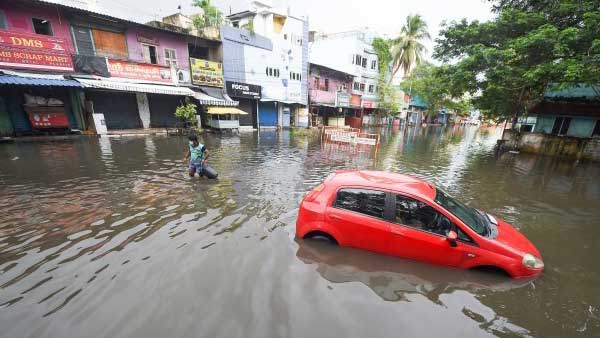 Villagers carrying dead bodies in a river overflowing in Virudhunagar, Tamil Nadu