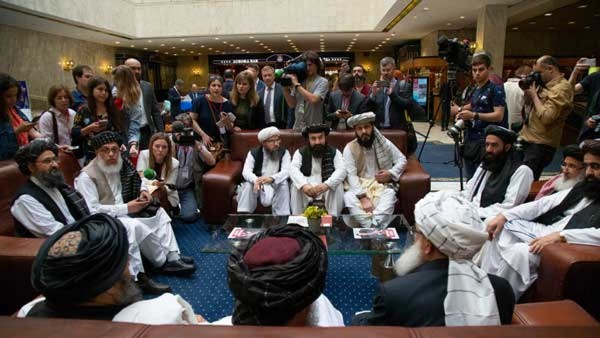 How did female footballers escape the Taliban-occupied Afghanistan?