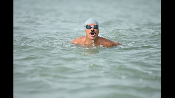Udupi: 66-year-old Man sets new record for swimming 3.5 km with hands and legs shackled
