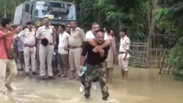 Assam BJP MLA Shibu Mishra Slammed By Social Media For Piggyback Ride Assam BJP MLA Shibu Mishra Slammed By Social Media For Piggyback Ride