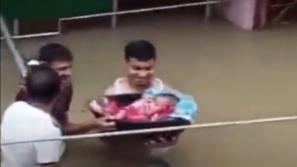 Father brought a newborn baby in Assam flood - people compared the scene to Krishna