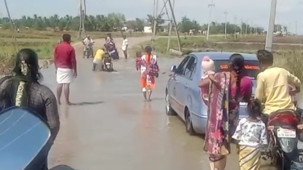  ಸೇತುವೆ ಮೇಲೆ ಹರಿಯುತ್ತಿರುವ ನೀರು 