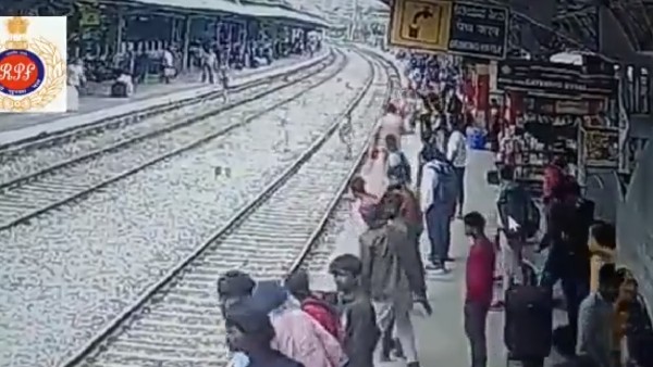 A Man Being Saved From The Tracks By Railway Staff A Man Being Saved From The Tracks By Railway Staff