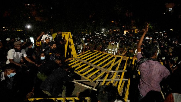 Sri Lankas President Gotabaya Rajapaksa flees as angry protesters storm his residence 