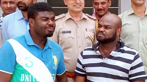 Two African nationals held for duping Guj woman of Rs 34 lakh Two African nationals held for duping Guj woman of Rs 34 lakh