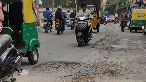 Due to rain Potholes created in Roads at Bengaluru Last one week