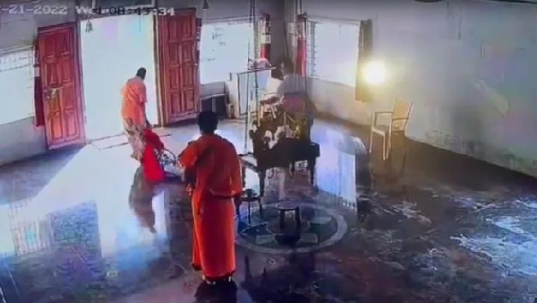 Woman beaten for spitting on priest: dragged out of temple by staff Woman beaten for spitting on priest: dragged out of temple by staff