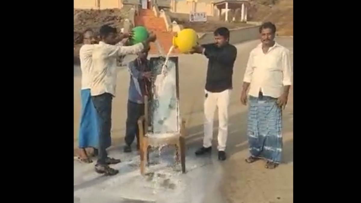 BJP MLA Madal Virupakshappas supporters pour milk on his portrait in front of a temple at Sulekere BJP MLA Madal Virupakshappas supporters pour milk on his portrait in front of a temple at Sulekere