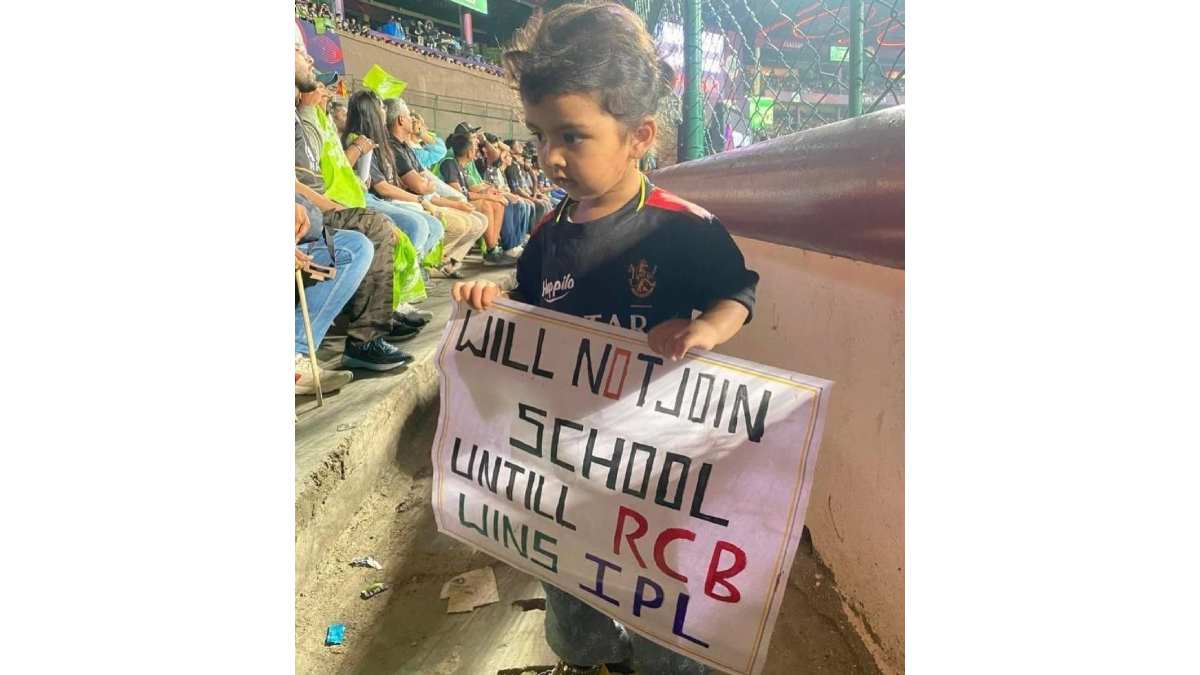 No school until RCB wins: little girl holding a placard during the IPL match went viral No school until RCB wins: little girl holding a placard during the IPL match went viral