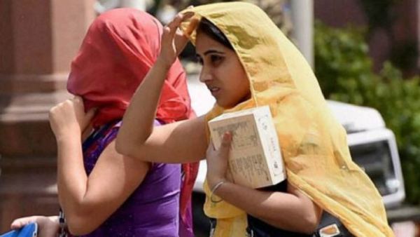 know details of District wise temperature record on April 15th in Karnataka state