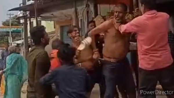 Man standing at bus stand has beaten