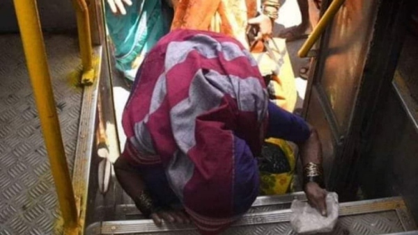 Old Women Bowing Down to Bus Door After Free Bus Inaugurated