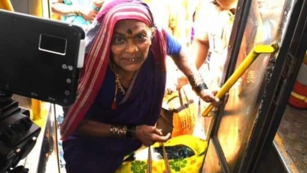 Old Women Bowing Down to Bus Door After Free Bus Inaugurated