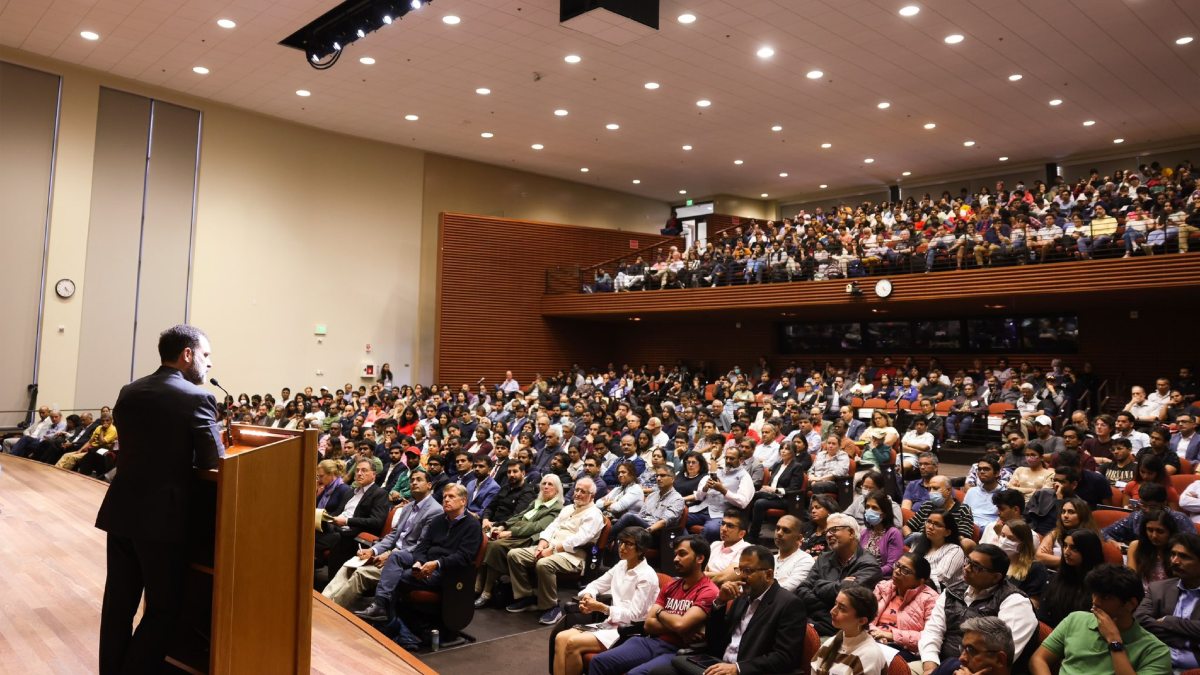 Rahul Gandhi speaks into his iPhone in US