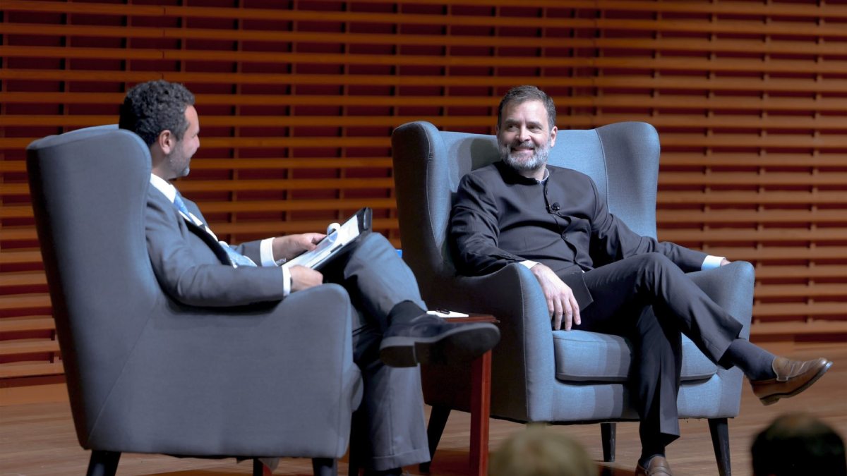 Rahul Gandhi speaks into his iPhone in US