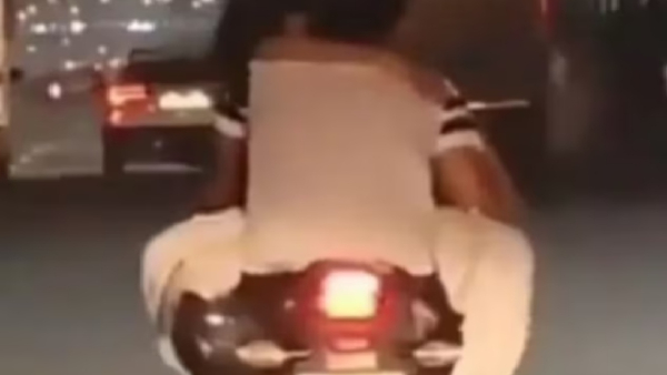 Young couple who kissed on a moving bike - anger of netizens