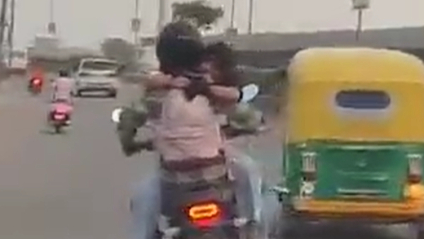 Boyfriend Hugging Girlfriend on Bike Petrol Tank - Video