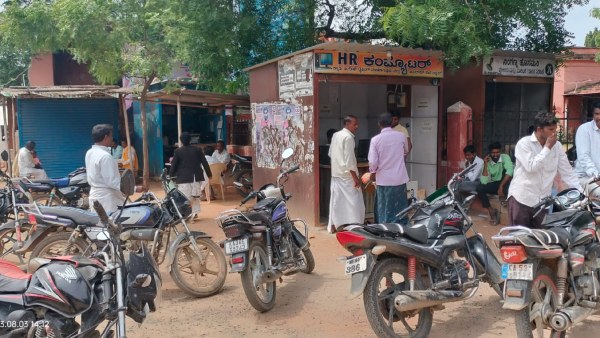 Vehicles Parking on footpath in Many places of Raichur district, problem for people 