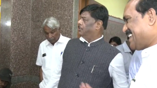 Minister Mahadevappa Getting Shoe By Bodyguard