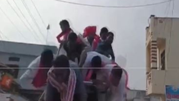 Telangana Minister KTR Raos Fall Down from a Vehicle During Election Rally in Armoor