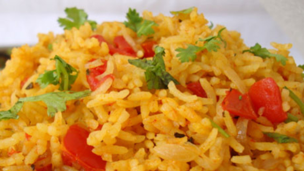 Spicy Tomato Rice Recipe: how to make Spicy Tomato Rice at home in Kannada