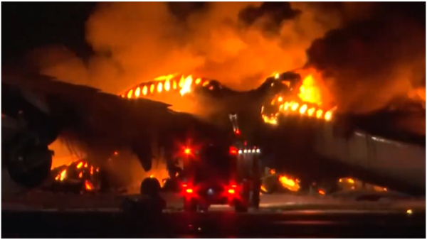 Japan Airlines Plane in Flames on Tokyo Haneda Airport Runway