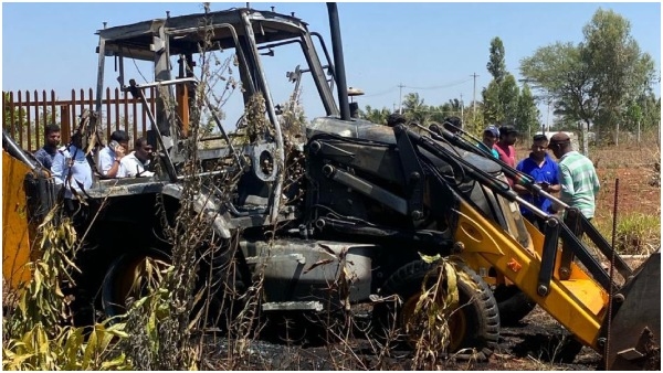 JCB Set Ablaze Near Bengaluru Amid Demolition Drive Against Encroachers JCB Set Ablaze Near Bengaluru Amid Demolition Drive Against Encroachers