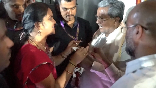 A Garland made from free bus tickets was gifted to CM Siddaramaiah by a student
