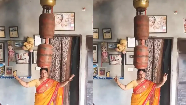woman dancing with a gas cylinder on her head- video viral
