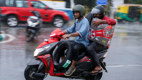 Bengaluru rain Bike-rider submerged in water what happened
