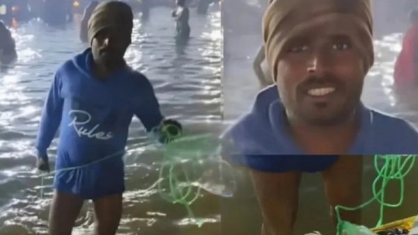 Man Collecting Coins Using Magnet At Mahakumbh Mela Prayagraj